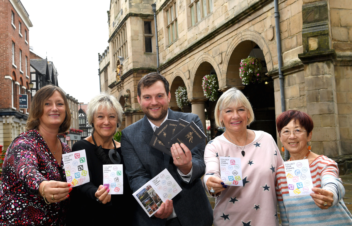 Some of the lucky winners collecting their prizes from Seb Slater, Executive Director of Shrewsbury BID