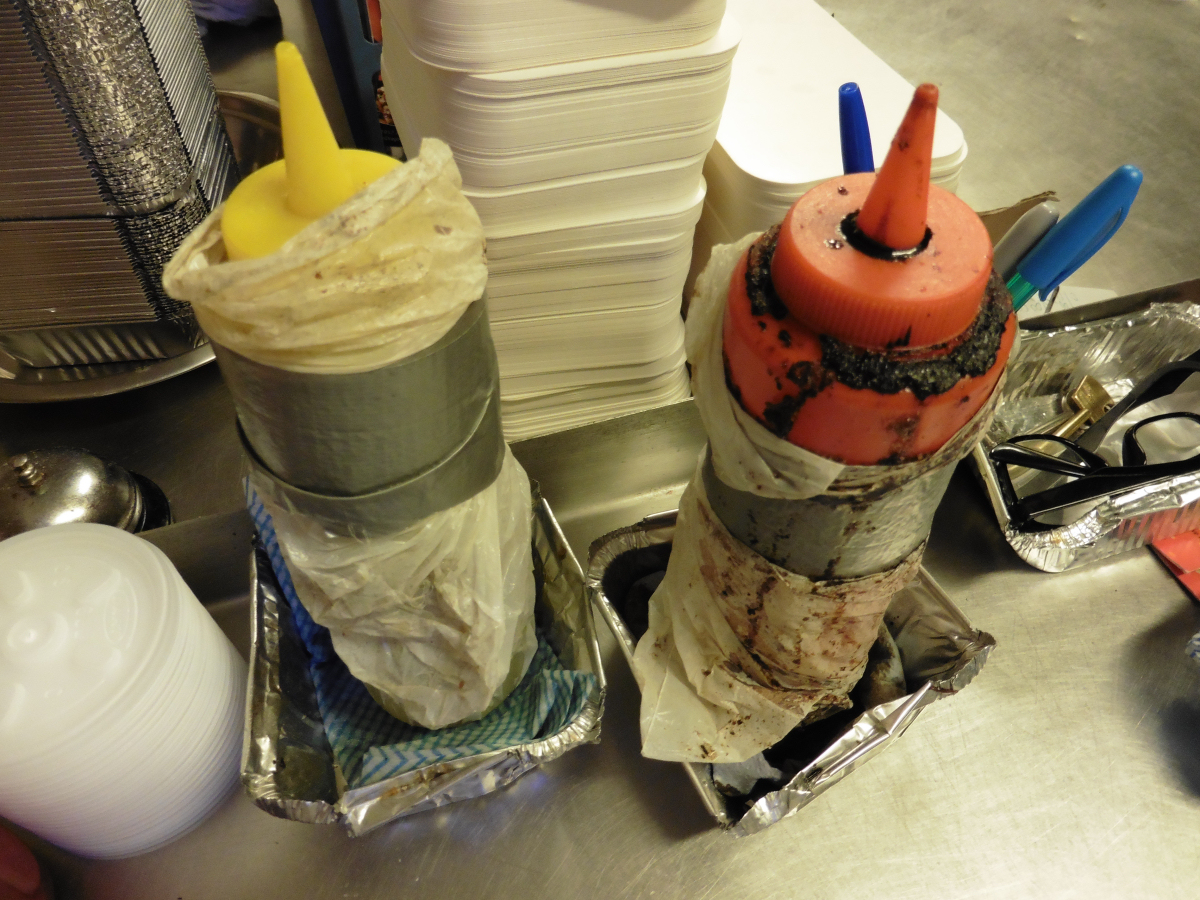 Sauce bottles at the business were found encrusted with food, wrapped in plastic bags and duct tape. Photo: Telford & Wrekin Council