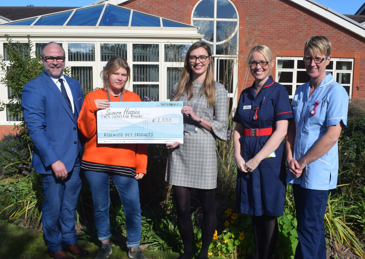 Members of the Rosewood Pet Products  team present a cheque to Severn Hospice