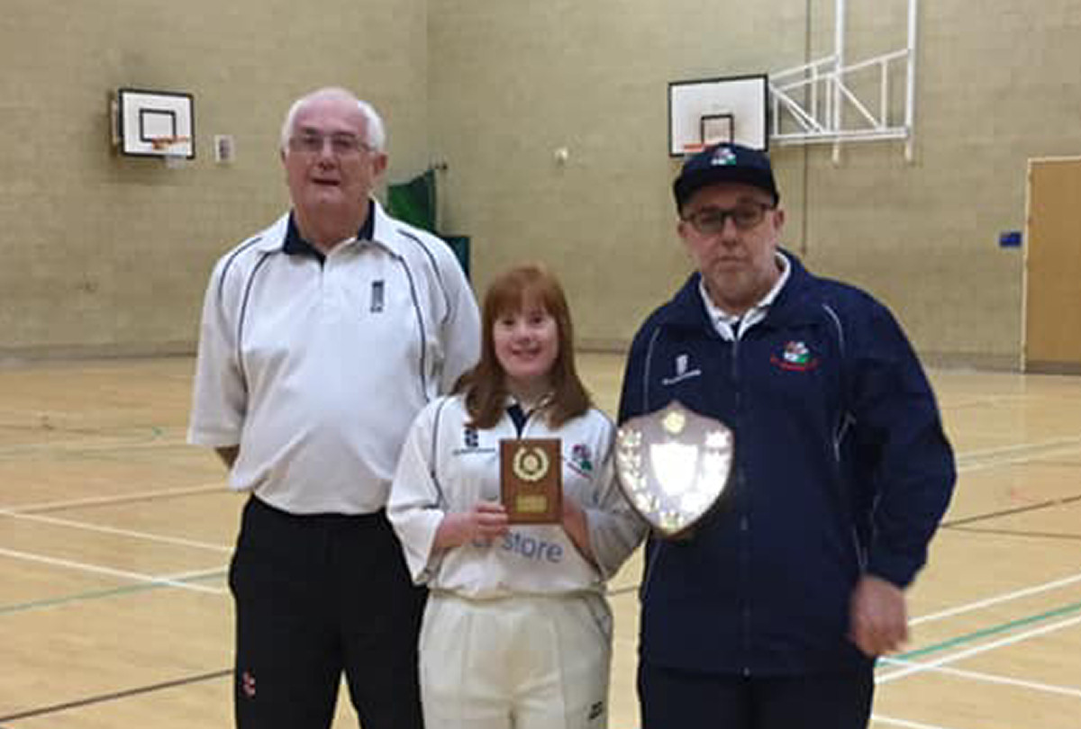 Georgie is pictured receiving her award from Graham (left) and League Chairman Ian Halford