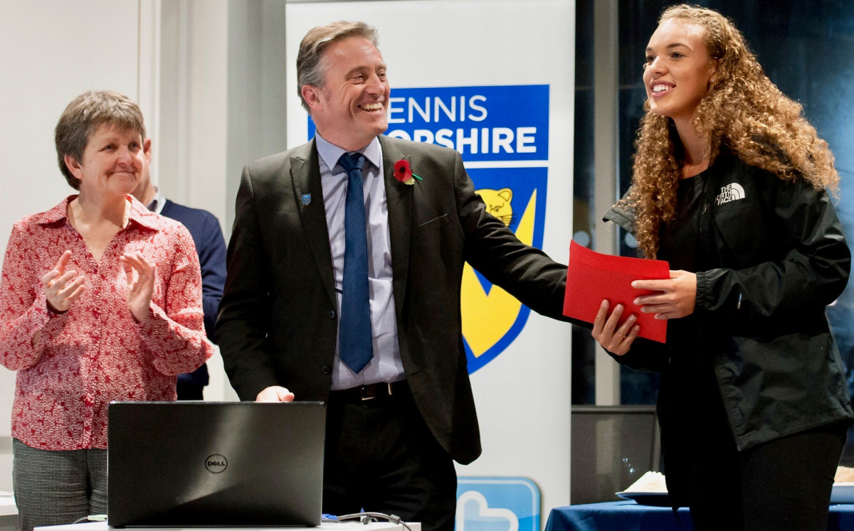 British player Freya Christie, who will celebrate her 21st birthday later this week, at last night's reception at Budgen Motors, with Julie Piper, the tournament director for the LTA, and Dave Courteen, the managing director of The Shrewsbury Club. Photo: Richard Dawson Photography