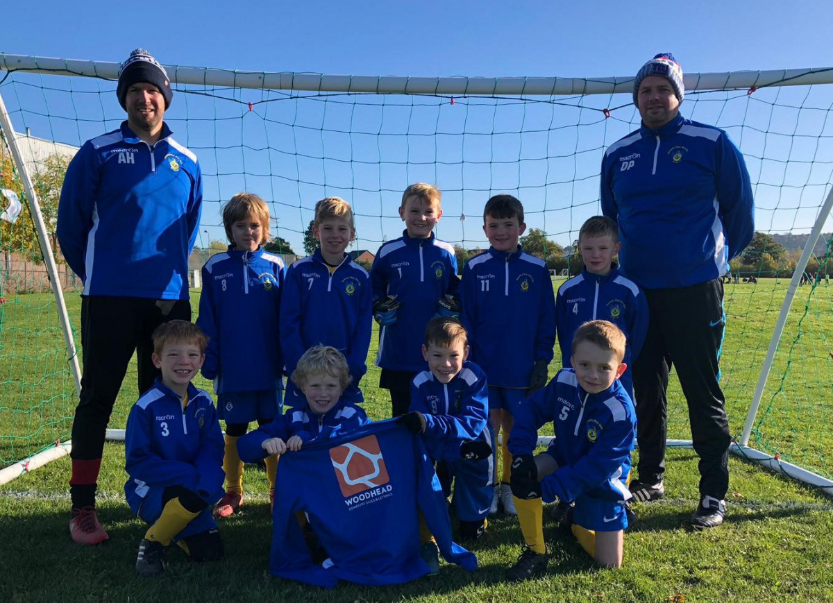 The Under 8 Blue Devils football team in their new tops
