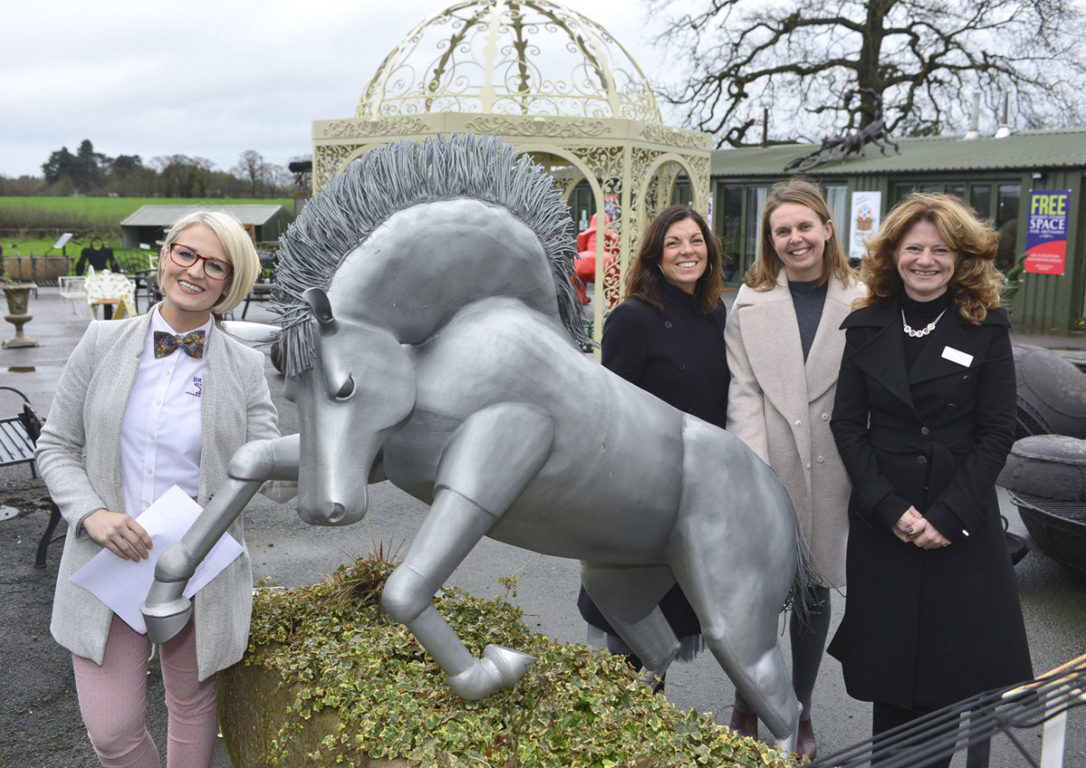 Pictured with one of the many sculptures on display are, from left, Sophia Knowles, Leanne Crowther, of Flower & White, Stacey Lea, and Hayley Jay, of Furrows