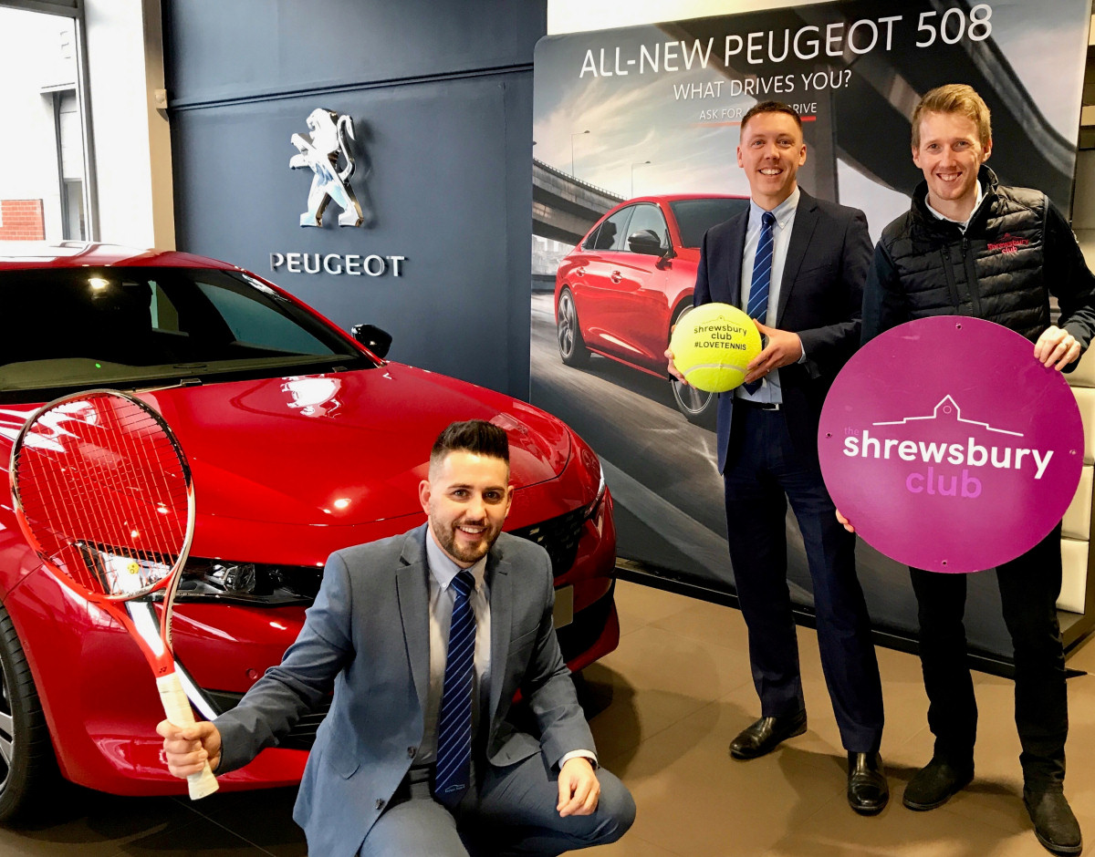 Danny Minshall, left, and Sam Owen from Budgen Motors with, right, Jon Gidney, The Shrewsbury Club’s marketing manager