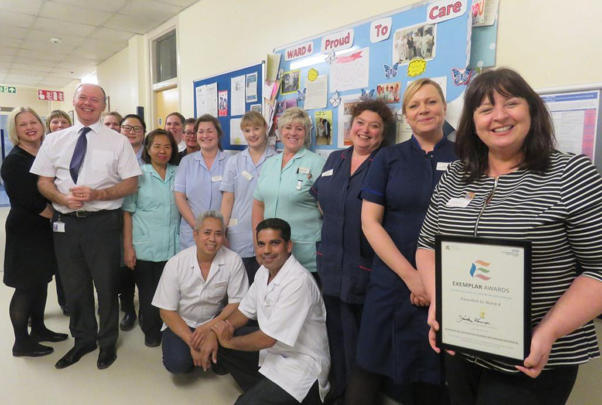 The ward team is presented with their certificate by Deirdre Fowler, Director of Nursing, Midwifery and Quality at SaTH
