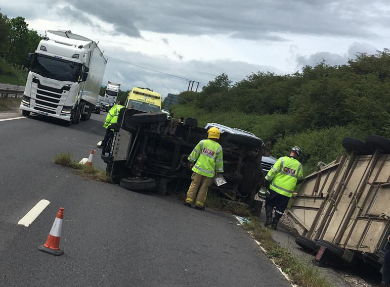 Firefighters at the scene of the overturned horsebox on the A5 in Shrewsbury. Photo: @SFRS_PDavies