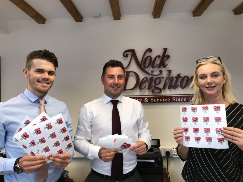 Nock Deighton staff with the stickers