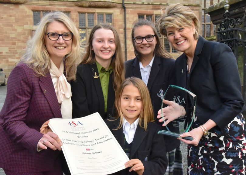 Head of Prep Nicky Candler, Head Girl Scarlett Ford, Prep School Head Girl Rosina Relf, Headmistress Diane Browne with the trophy and (front) Lily Hudson, of Year 3