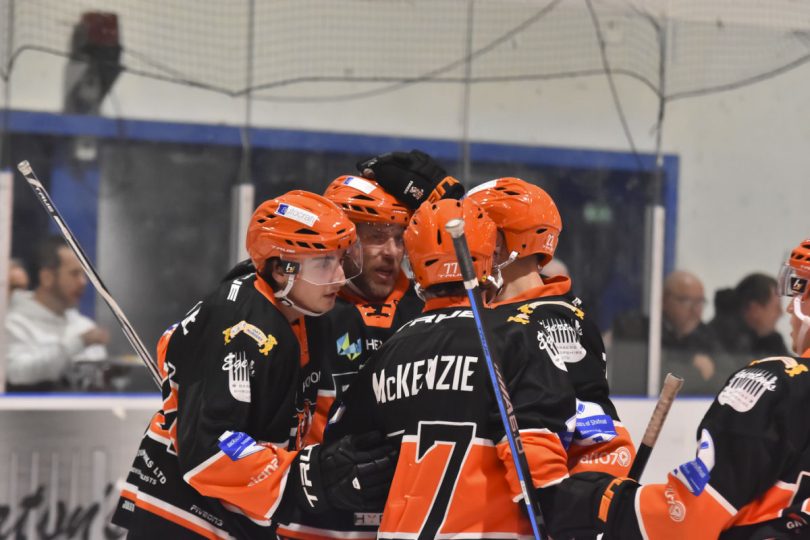 Players celebrate with Brandon Whistle. Photo: Steve Brodie