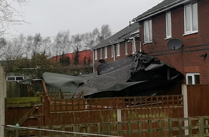 A number of homes in Shrewsbury have been damaged after a section of roof came off industrial units in Kendal Road. Photo: Barrie Mansfield