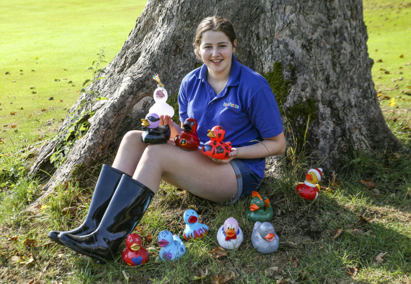 Hope House volunteer Lucy Eyes with some of the dressed-up ducks