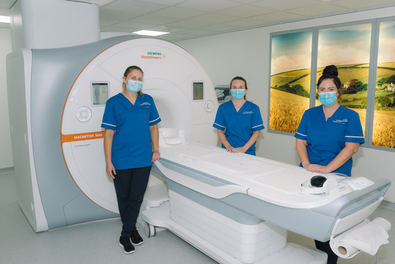 MRI Radiographers Meg Evans, Jodie Rogers and Gemma Jones with the new MRI scanner