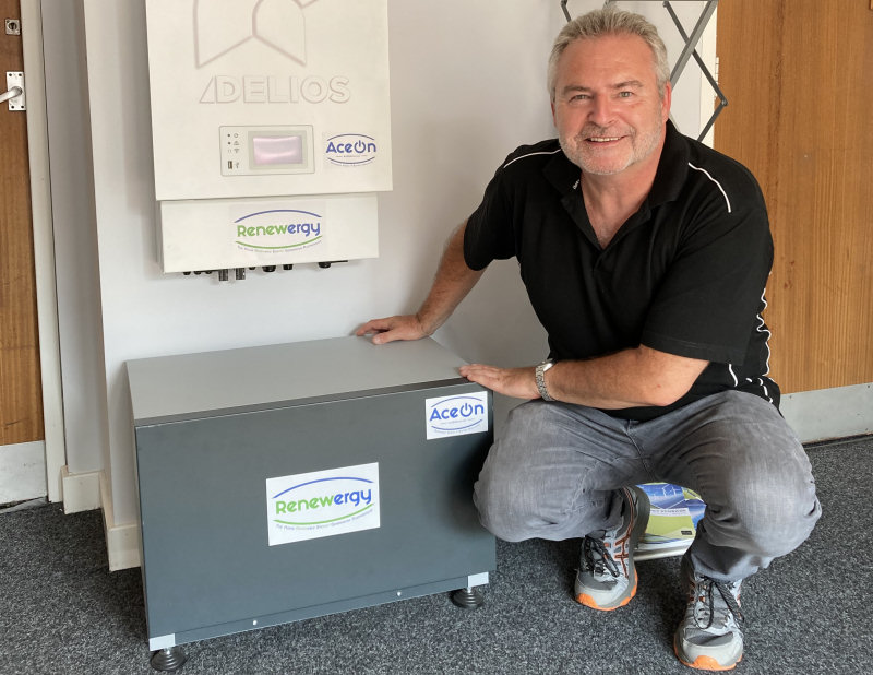 Richard Partington with the VPP inverter and battery