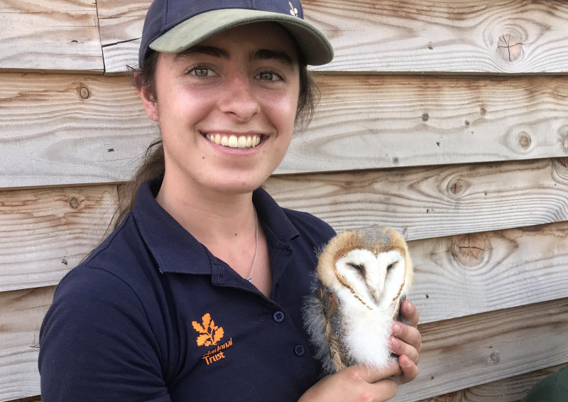 Ranger Sophie Bloor holding one of the young owls
