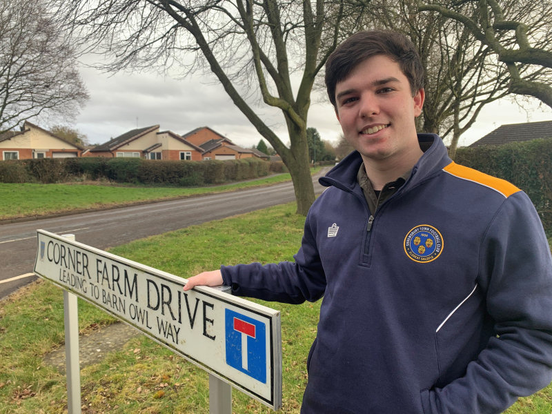 Cllr Wagner on Corner Farm Drive, a site for a potential crossing, with Gains Park Way in the background