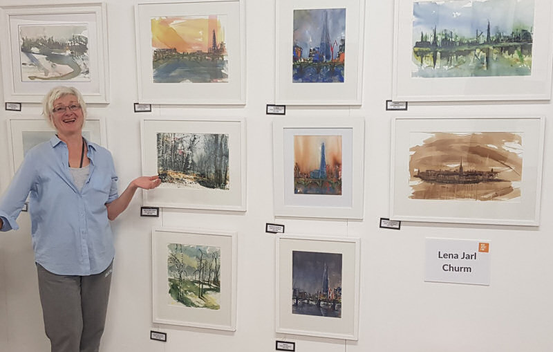 Lena Jarl Churm with some of her paintings