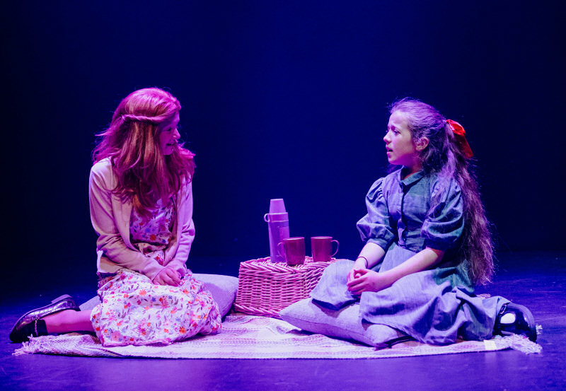 Lyla Saxton and Issy Hickman on stage as Miss Honey and Matilda. Photo: Shaun Culliss