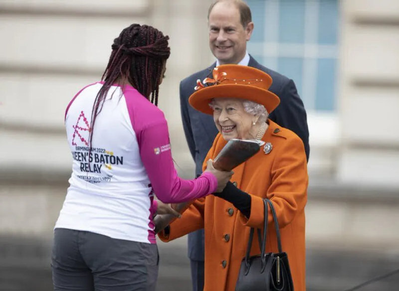 Kadeena Cox receives the Baton from The Queen at the start of its journey