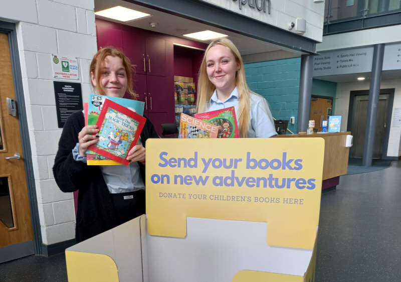 Annie Rogers and Lauren Humphreys with one of the book boxes