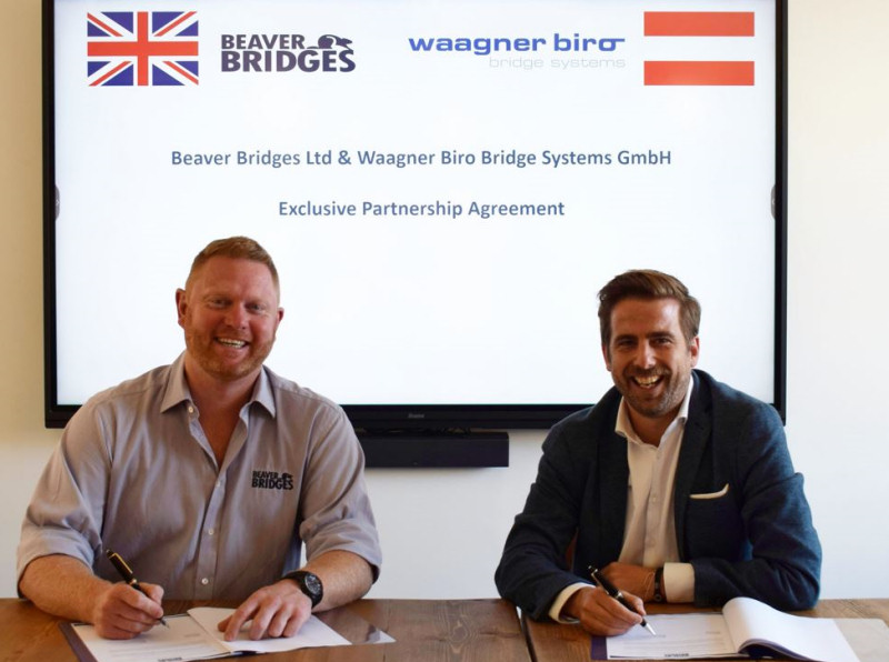 Pictured signing the agreement are Henry Beaver, Chief Executive of Beaver Bridges and Richard Kerschbaumer, Managing Director of Waagner-Biro Bridge Systems GmbH