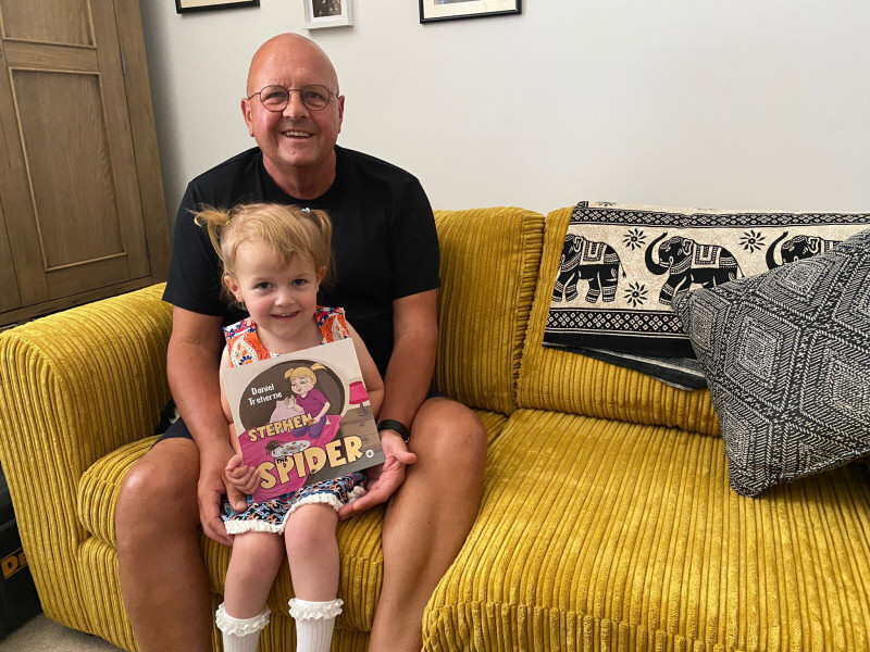 Daniel Treherne pictured with granddaughter and the new book