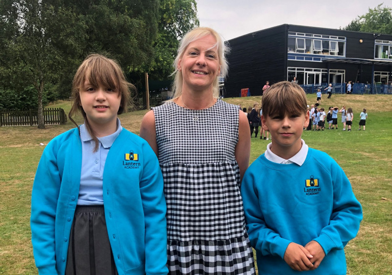 New Lantern Academy head teacher Michelle Skidmore, with pupils Isabelle Trowers and Reeun Ainsworth in the new uniform