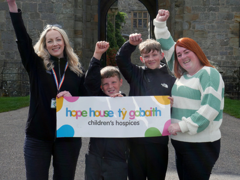 Katie Rees-Jones, Senior Volunteer and Community Officer at Chirk Castle (far left) with Mia's mum Martine and her brothers Liam and Kyle