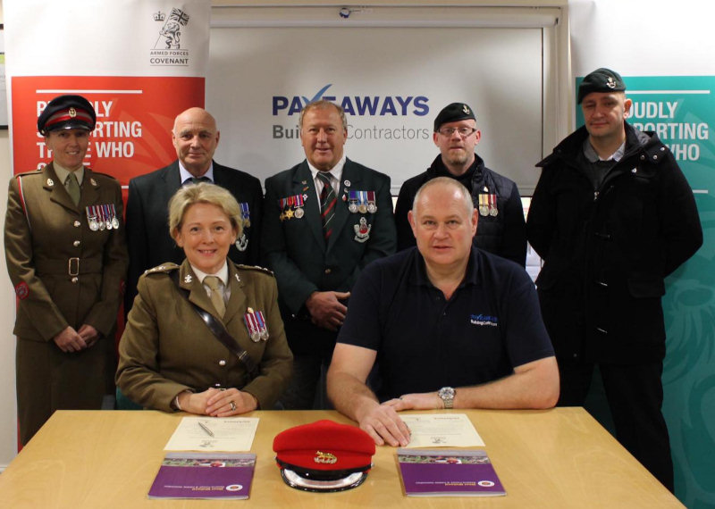 Lt Col Samantha Brettell and Steven Owen sign the covenant watched by Armed Forces lead at The Robert Jones and Agnes Hunt Hospital Rebecca Warren and former military personnel John Friend, Ray Green, Jed Stone & Russ Hale