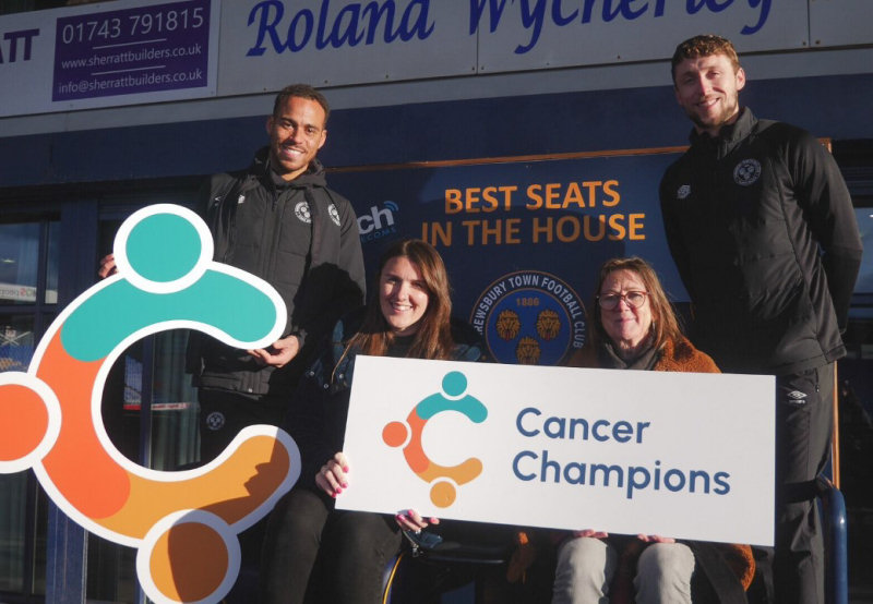 Shrewsbury Town players Elliott Bennett and Matthew Pennington with Holly Corrigan from Qube and Miranda Ashwell, LiveLife Project Lead for Lingen Davies Cancer Fund