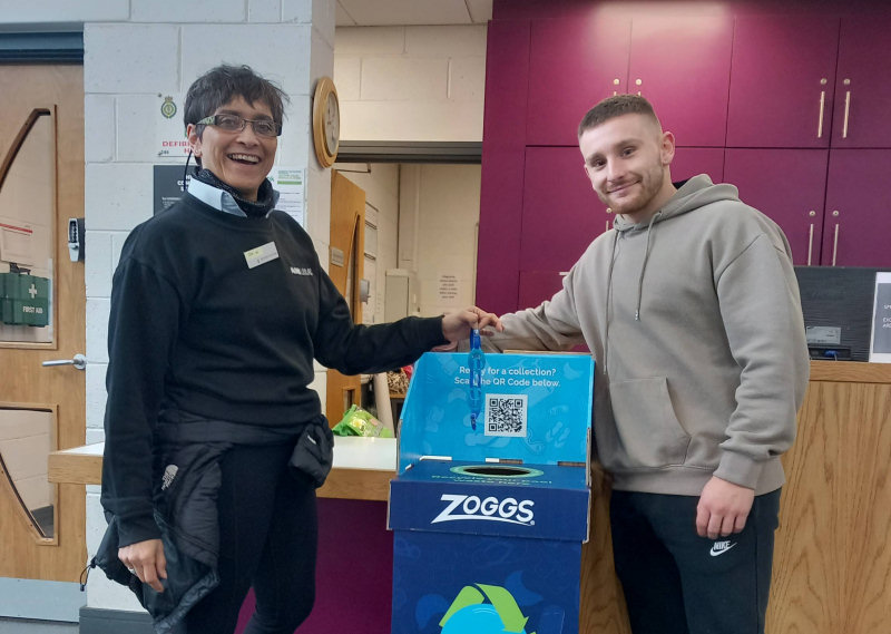 Sue and Liam at Oswestry swimming pool with one of Leisure Loops re-cycling boxes