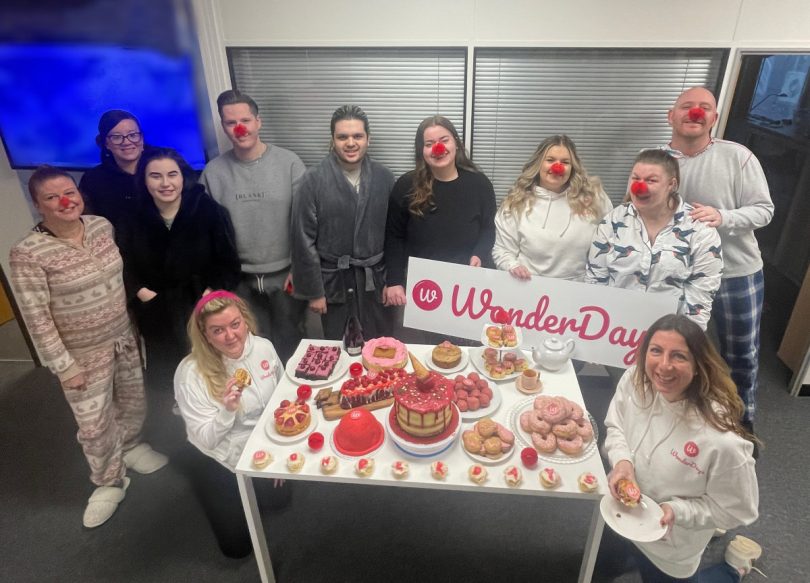 The WonderDays team with their host of home baked afternoon tea creations to raise money for Comic Relief 2023