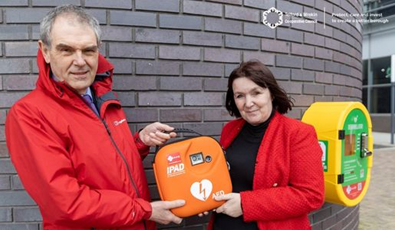 Councillor Andy Burford and Councillor Kelly Middleton with one of the new defibrillators. Photo: Telford and Wrekin Council