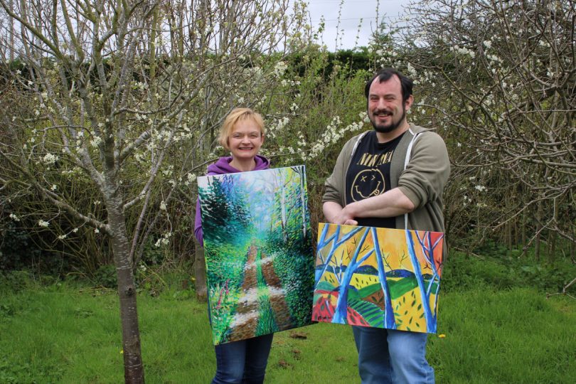 Ben and Louise with some of their artwork