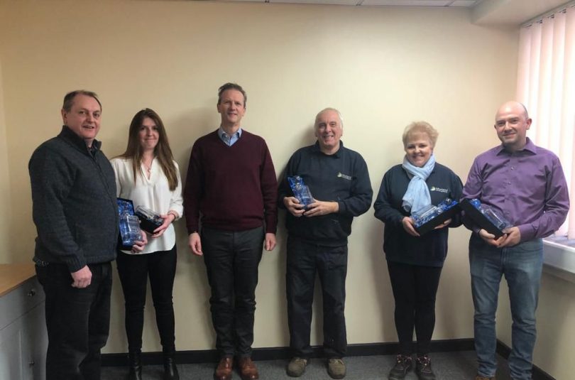 James Morris, Group Managing Director of the Interior Products Group Ltd, with staff members from Morland UK and Newmor celebrating their long service milestones totalling nearly 180 years