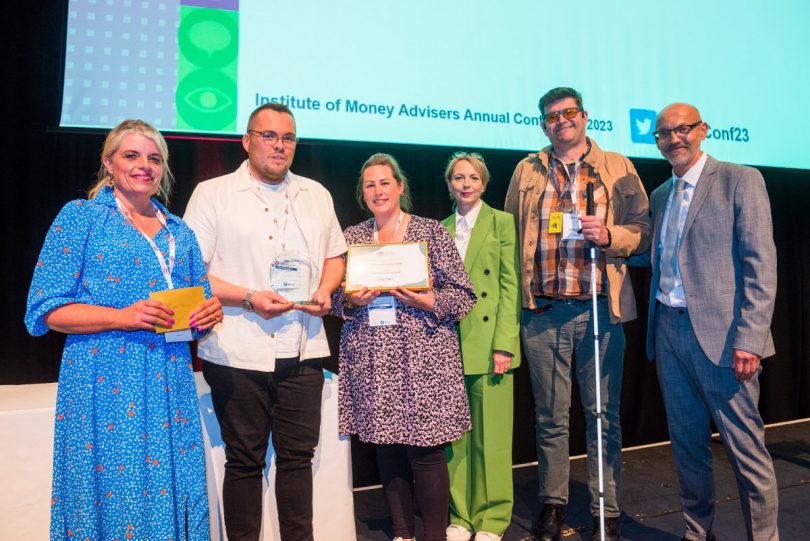 Wrekin Debt Advice team - Sam Siviter, Dan Bebbington & Lois Harding recieve their award from the IMA