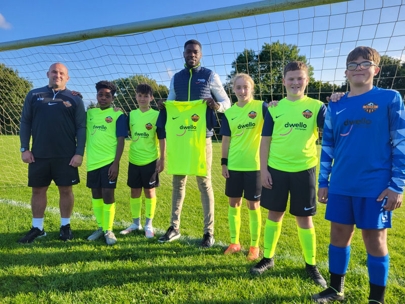 Nathan Blissett from Dwello Mortgages with Karl Williams, Lawley Lightmoor under 13s Comets team coach and players from the team in their new sponsored kits