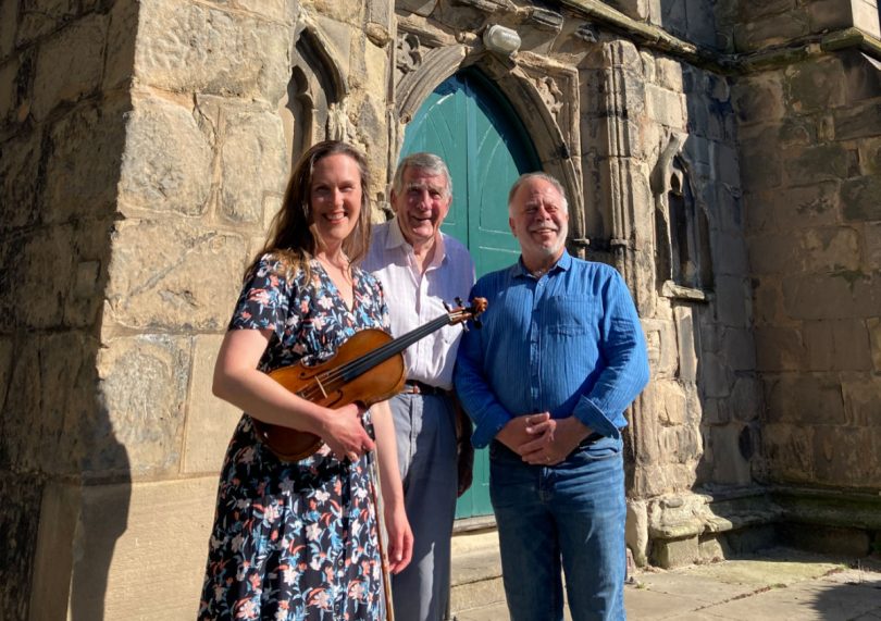 Zoe Beyers with David Waterhouse and John Moore of the Shropshire Music Trust outside St Almund's Church