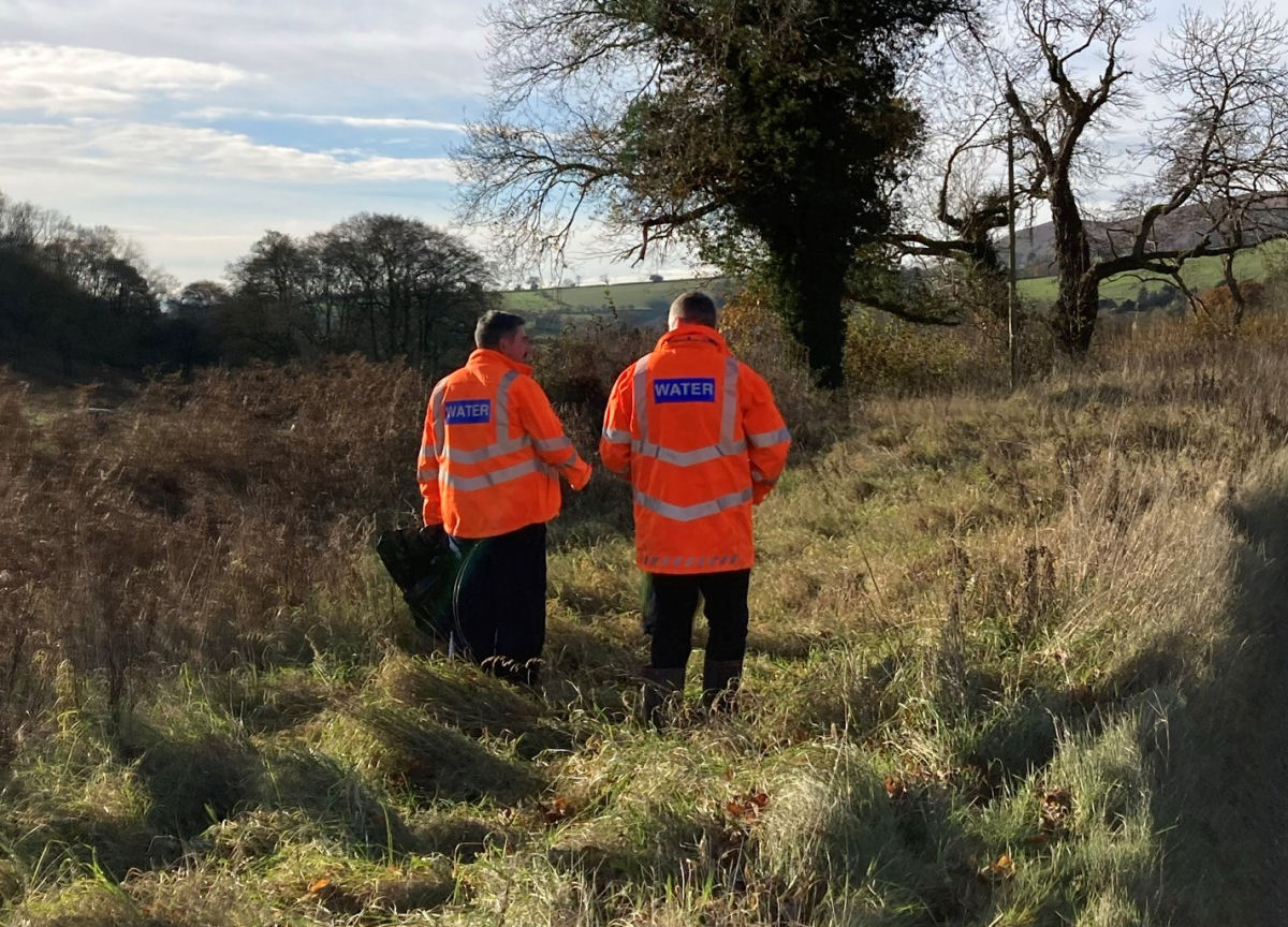 Severn Trent staff re-seeding the road verge