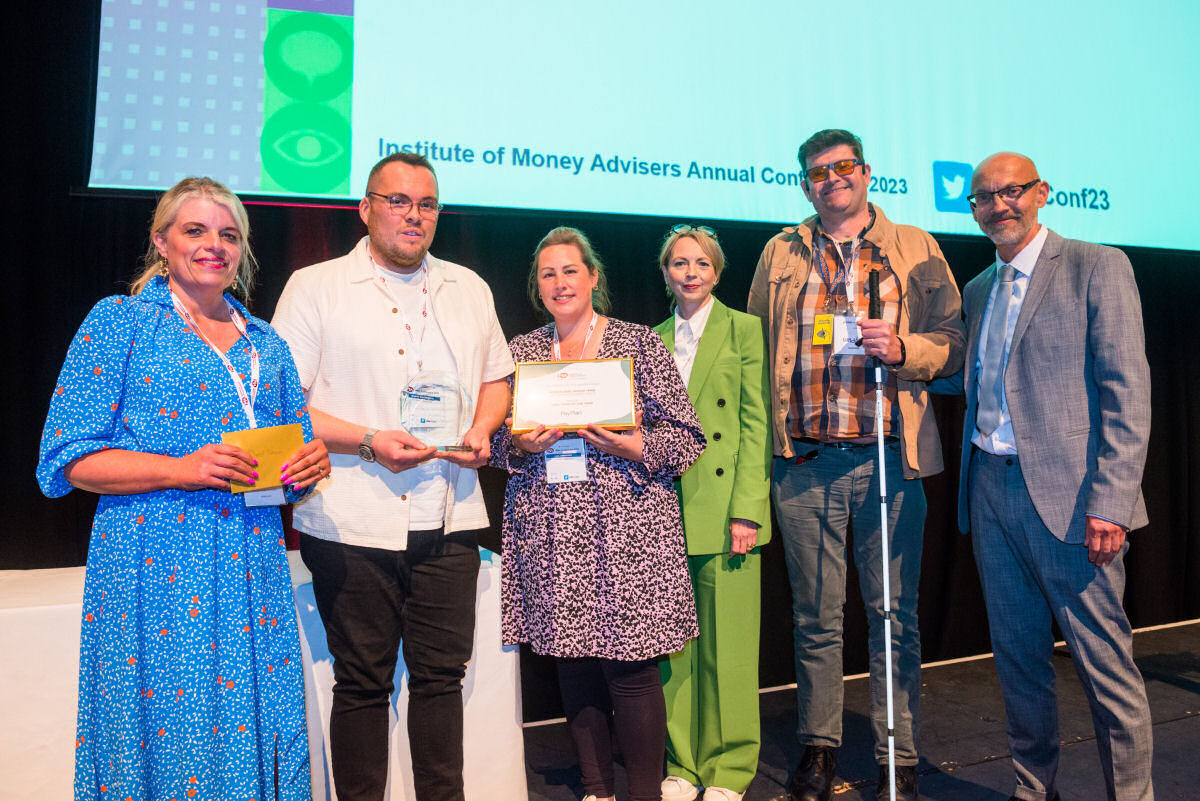 Wrekin Debt Advice team - Sam Siviter, Dan Bebbington & Lois Alexander recieve their award from the IMA