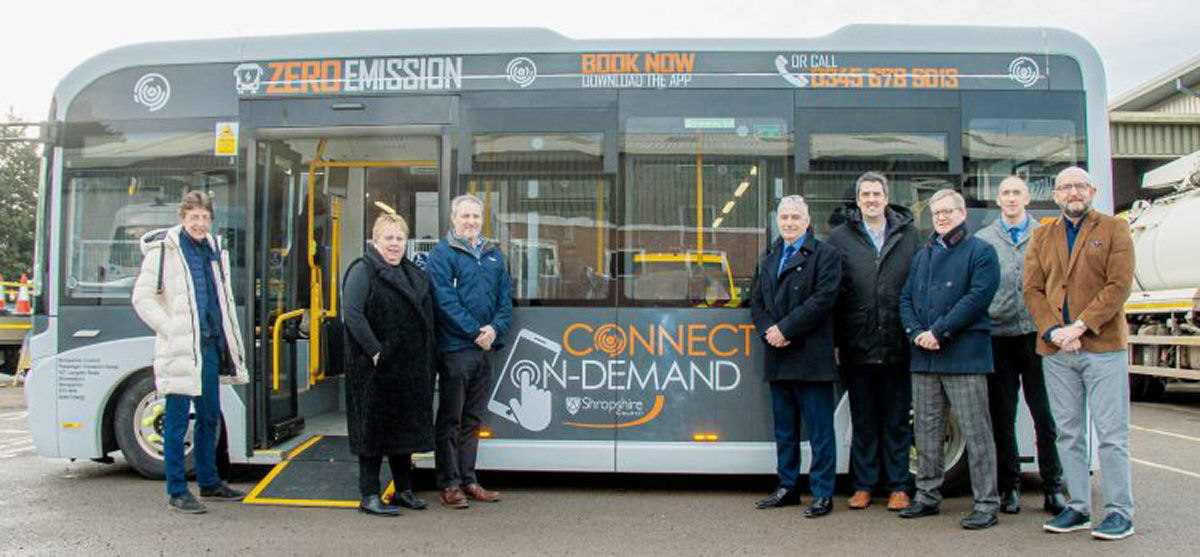 Officials from the DfT with Shropshire Councillors and officers, and one of the Connect On-Demand buses. Photo: Shropshire Council