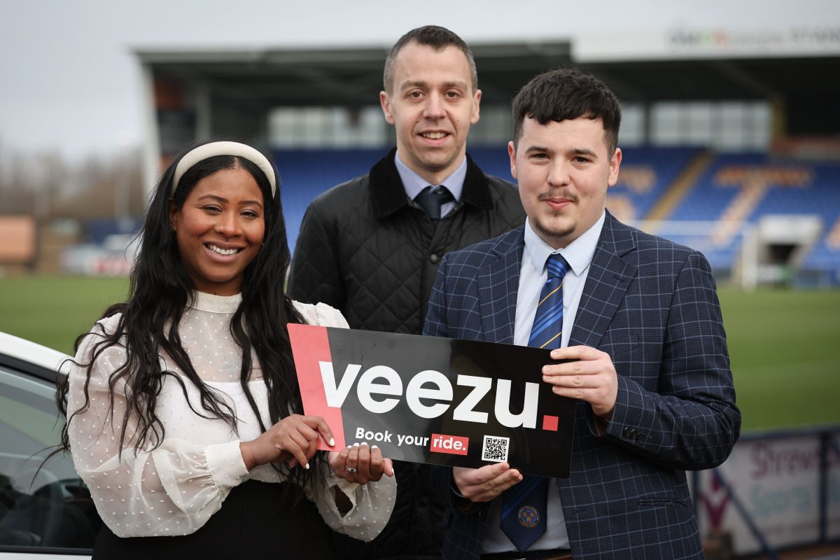 Letitia Young, Hyperlocal Marketing Manager at Veezu pictured with Craig Bexon Business Development Manager Veezu and Luke Edwards of Shrewsbury Town Football Club
