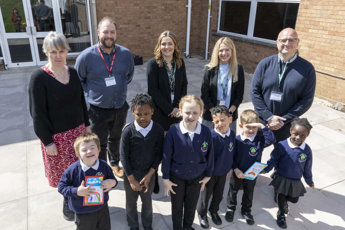 Photographed from left to right with children from Donnington Infant School are Caroline Boddy, Headteacher, Donnington Infant School, Matthew Cotton, Senior Quantity Surveyor, Lovell, Laura Benting, Development Programme Manager, Wrekin Housing Group, Kelly Truman, Regional Training Manager, Lovell and Councillor Lee Carter, Cabinet Member for place, the economy and neighbourhood services, Telford & Wrekin Council.