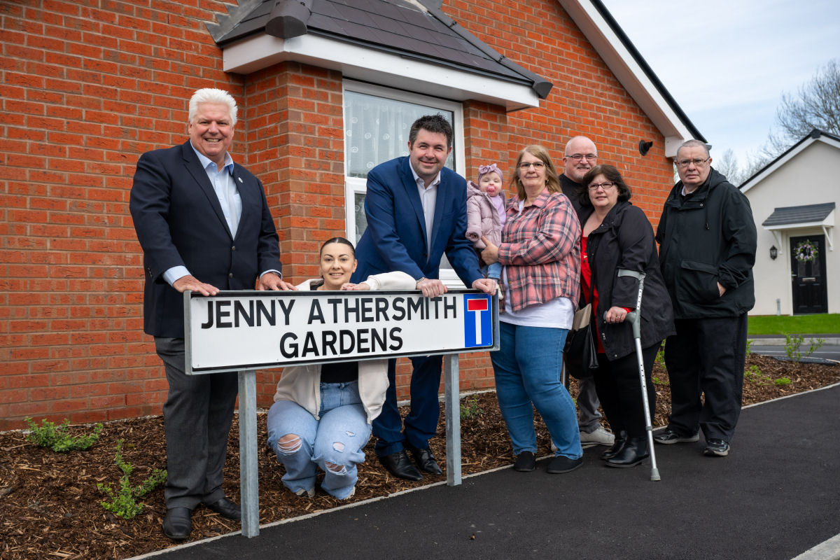 Members of Jenny Athersmith's family with Wrekin's Group Chief Executive Wayne Gethings and Councillor Shaun Davies, leader of Telford & Wrekin Council, next to the road sign.