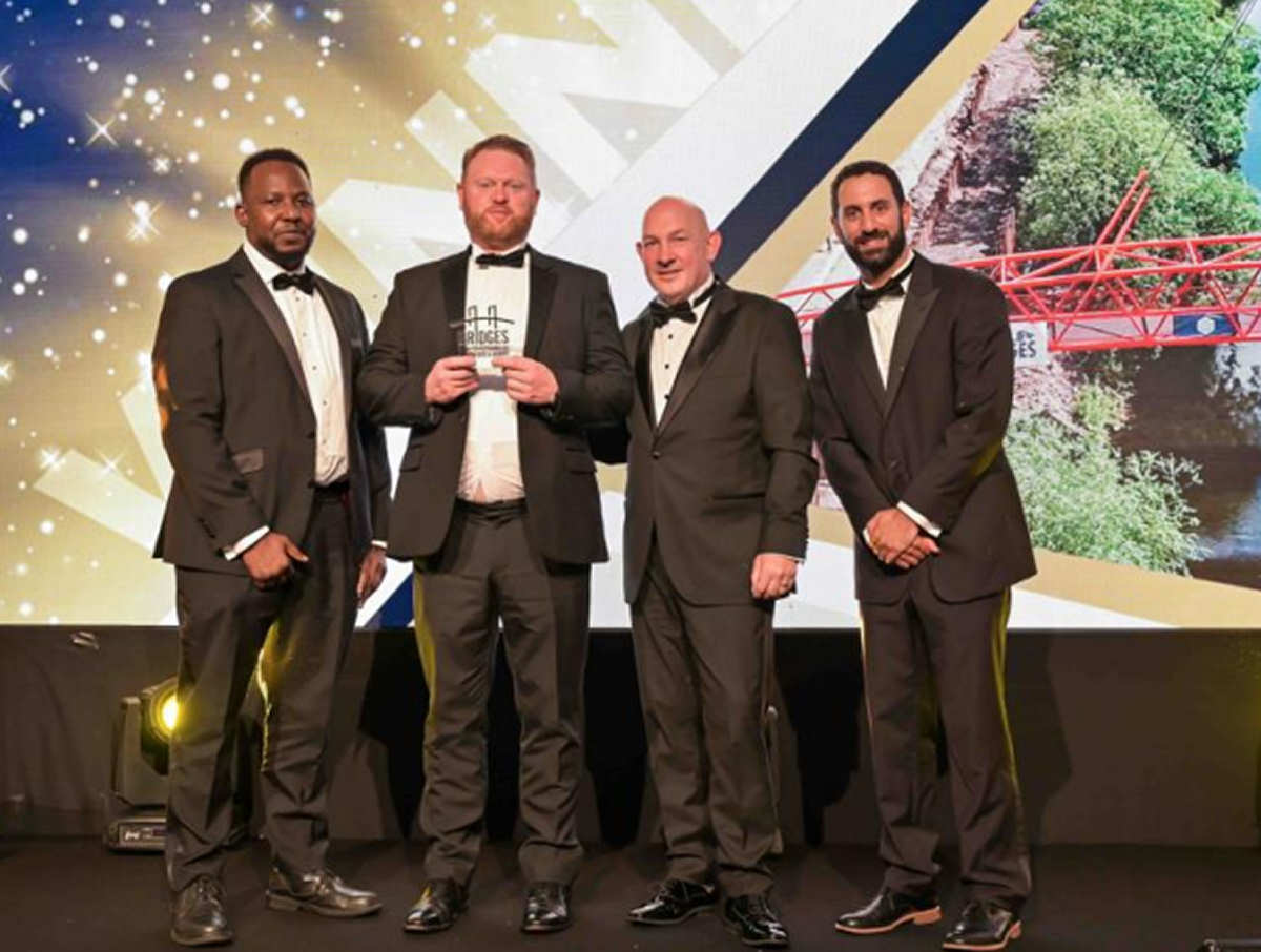 Members of the Beaver Bridges team collect the award on stage in London