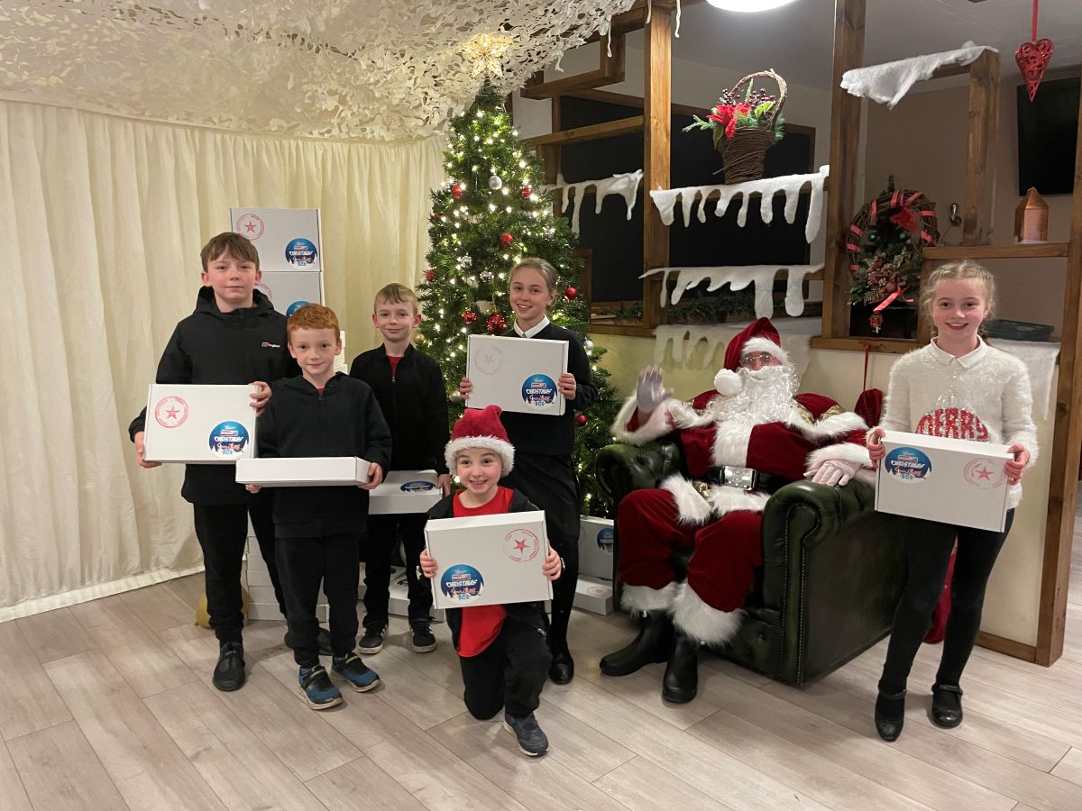 Father Christmas distributes little trooeprs boxes at Clive Barracks