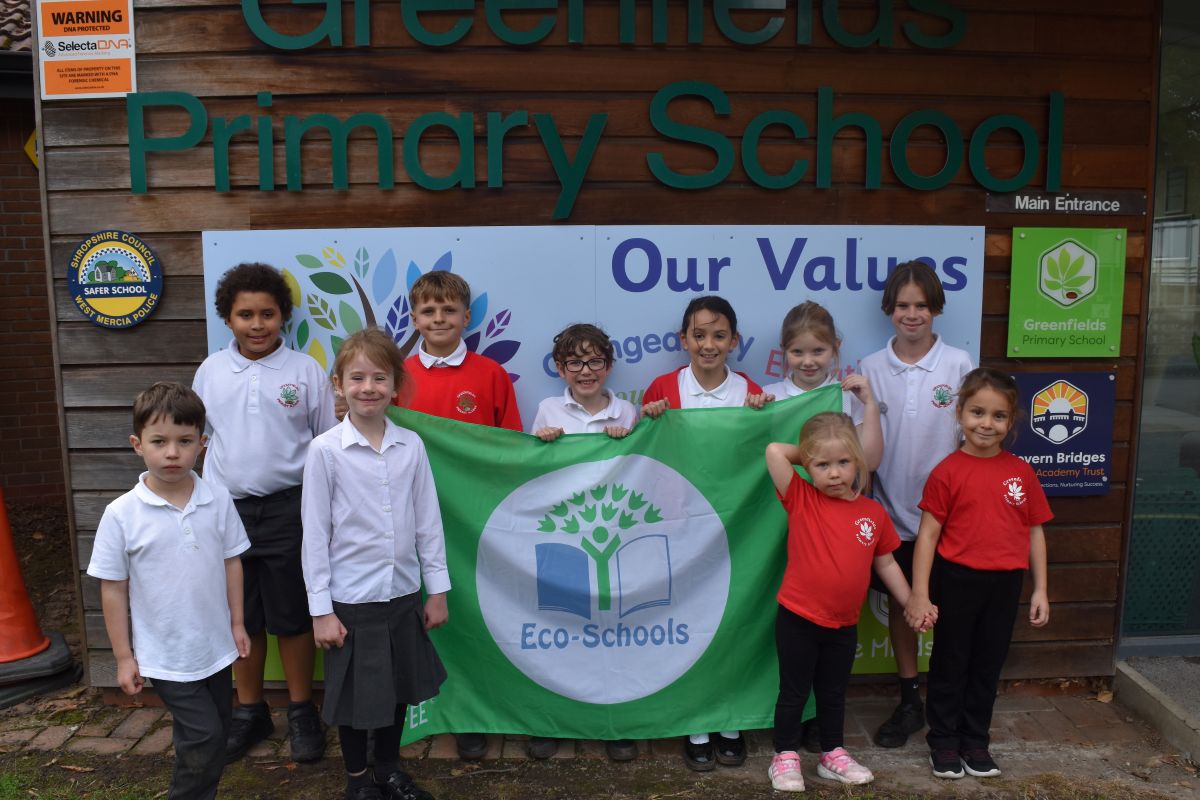 Greenfields Primary School pupils pictured with the prestigious Eco-Schools Green Flag