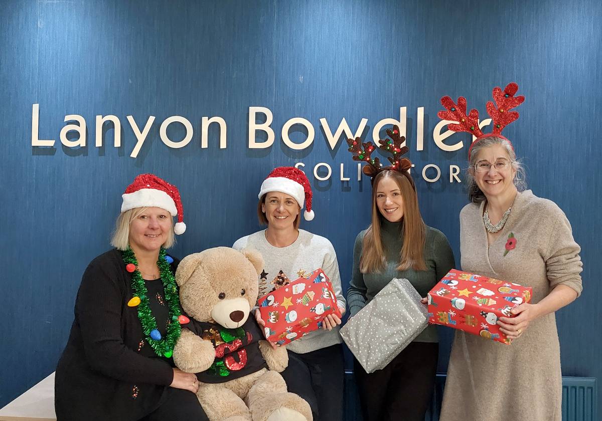 Lanyon Bowdler staff Amanda Clarke, Vicki Thomas, Natasha Gibbons and Dawn Humphries getting ready to receive Christmas shoeboxes