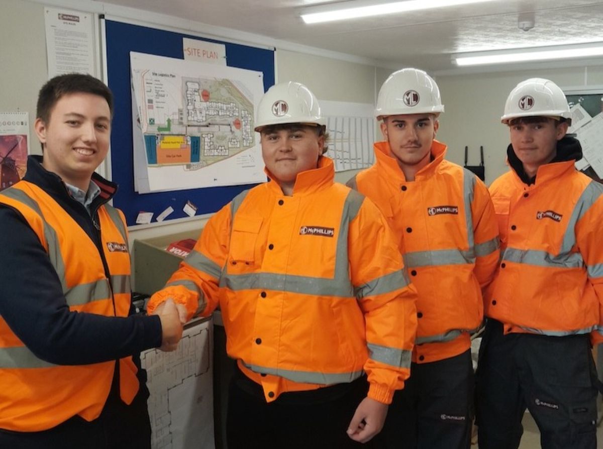 Trainee Quantity Surveyor George Hampson (left) welcomes new apprentices Alfie Flack, Jaydee O’Neill and Josh Freestone-Gittins to the McPhillips business